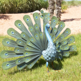 Peacock in coloured metal